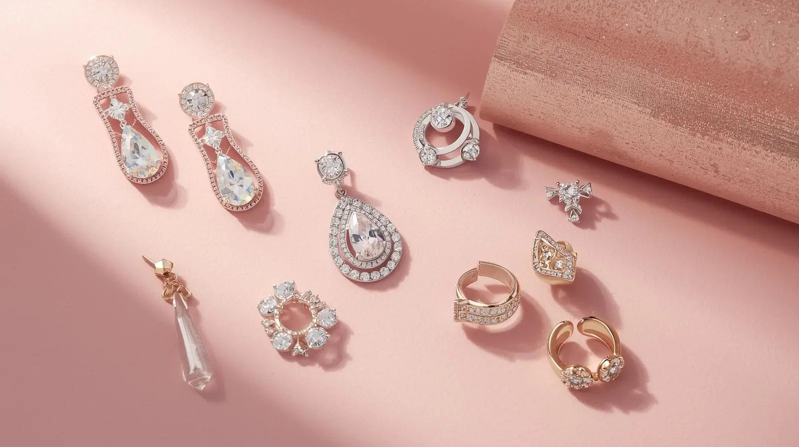 Assortment of gold and silver earrings, including hoops, studs, and dangle styles.