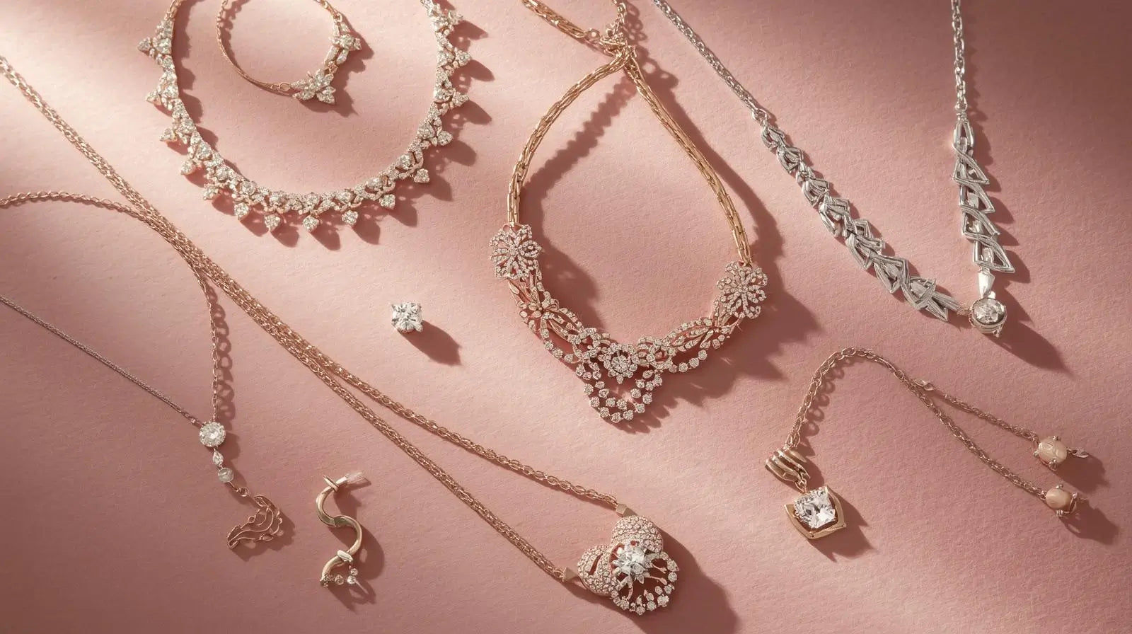 Assortment of layered necklaces, including delicate gold chains, bead necklaces, and statement pendants featuring gemstones and charms.