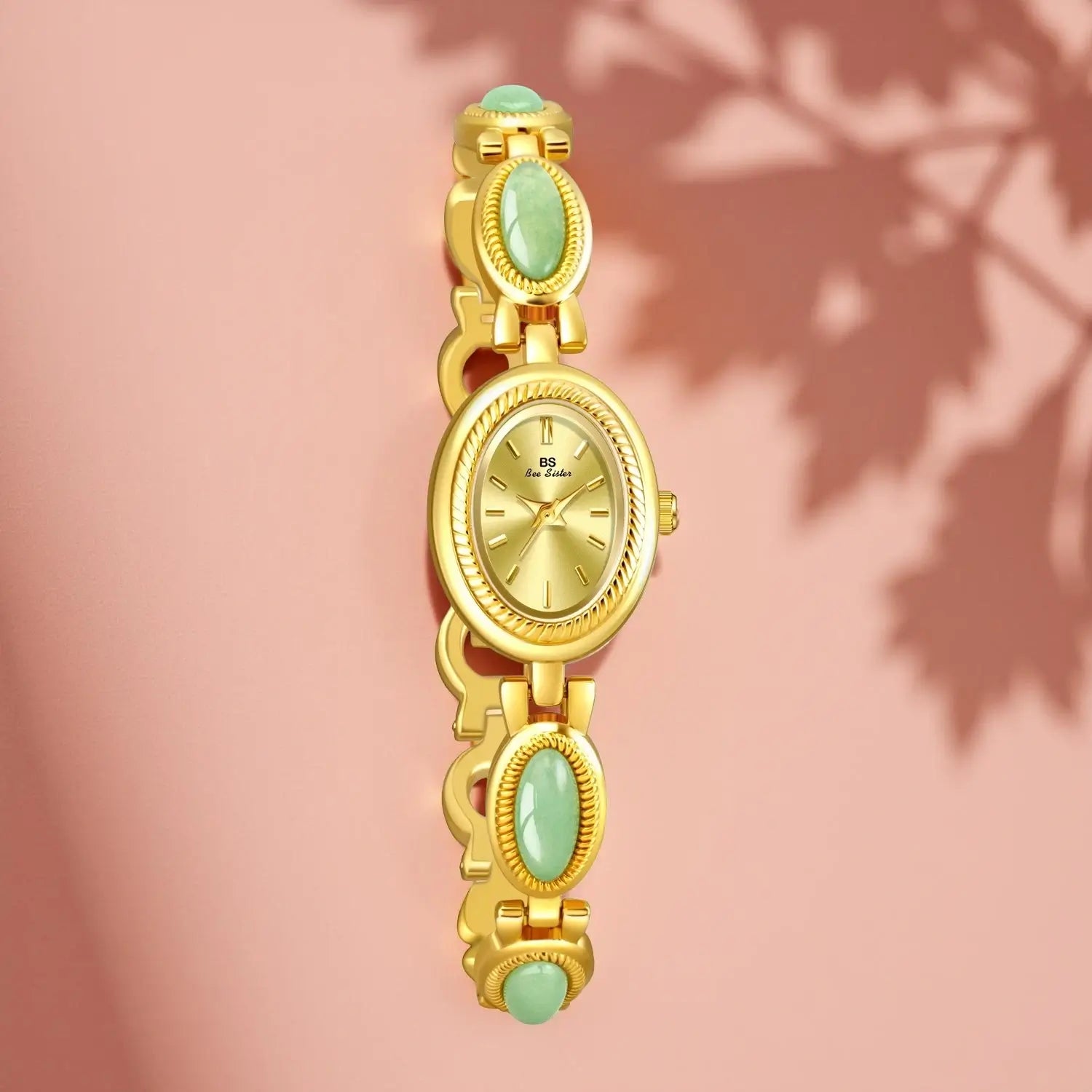 Women's luxury watch with a gold-tone bracelet accented by multiple oval Hetian Jade stones and a matching gold sunray dial.
